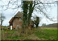 Cottage by footpath near Dudbridge