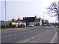 TG2701 : B1332 The Street, Poringland by Geographer