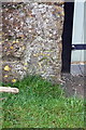 Benchmark on barn next to Christmas House, Aynho Road