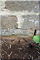 Benchmark on barn beside B4100 NW of Nell Bridge