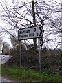 TM0980 : Roadsign on the A1066 High Road by Geographer