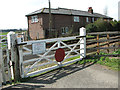 Cottages by the railway at the end of Burnt House Lane