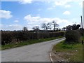 Road bends right into Ley Green