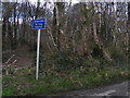 SX6495 : Woodland and sign at Furzedown Cross by Rob Purvis