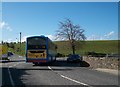 The Newry to Crossmaglen bus negotiating the sharp bend leading from the bridge at Silverbridge