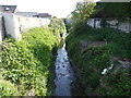 Stream running between houses on Charlmead