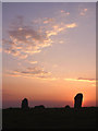 NY7266 : Sunset over the Mare and Foal standing stones by Karl and Ali