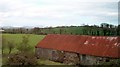 Tin roofed farm building alongside the A25