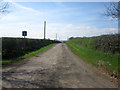 NU0526 : Farm lane to Chillingham Barns by Graham Robson