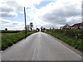 J0014 : View south-westwards towards the Irish Border along Shean Road by Eric Jones