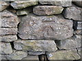 Benchmark on the north side of Silsden Road, Addingham