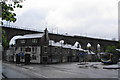 Bus and train passing the Bridge Hotel, Durham