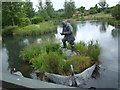 View of the Peter Scott statue in the river in the London Wetlands Centre