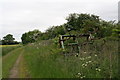 Farm track in North Kyme with old agricultural implement