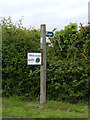 TM4884 : Footpath sign & Twin Oaks Barn sign by Geographer