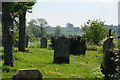NY5218 : The churchyard of St Patrick's, Bampton Grange by Bill Boaden