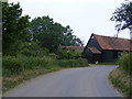 TM4581 : Clay Common Lane, footpath & Low Farm by Geographer