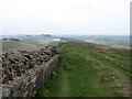 NY7467 : Hadrian's Wall descending to Peel Gap by David Purchase