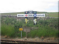 NT9757 : Railway signs at the Scottish border by Graham Robson