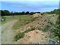 Gravel heaps with horse operation beyond