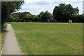 Footpath towards Woodcock Hill through recreation ground