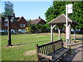 The village sign, bus stop and shelter on the green at Brasted