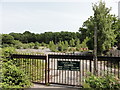 Gated entrance to waste land of 