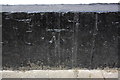 Benchmark on black skirt of #24 St Mary