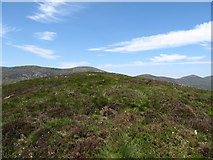 J2922 : View north-west towards the summit stile on Slievenaglogh by Eric Jones