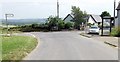 Road junction and phone box at Penlon Betws