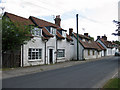 White-painted stone cottages along the street