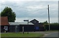 Bus stop at road junction in North Charford