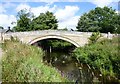 Cyclists crossing Thropton Bridge