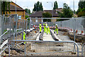 Workers on the new track