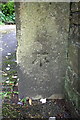 Benchmark on gatepost at entrance to 