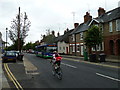 High Street, Hungerford: cyclist and bus about to cross