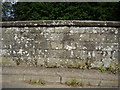 Ordnance Survey bench-mark on former railway bridge