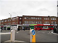 TQ1473 : Shops at the junction of Nelson Road and High Street Whitton by David Howard