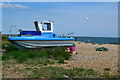 Boat drawn up on beach near Sovereign Harbour