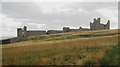 NU2521 : Looking towards the southern wall of Dunstanburgh Castle by Graham Robson