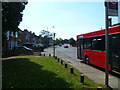 Looking along Mill Road from the bus stop on The Green