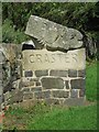 Carved sign at entrance to Craster