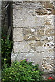 Benchmark on porch of St Ann