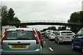 A footbridge crosses the M6 near Lower Peover