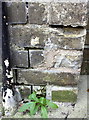 Damaged benchmark on Headington Post Office