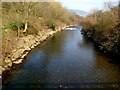 Afon Afan flows towards a footbridge south of Cwmavon