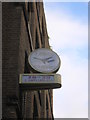 Rear of clock on former travel firm