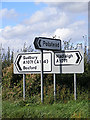 TL9941 : Roadsigns on the A1071 Coram Road by Geographer