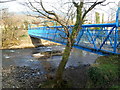 Side view of a blue footbridge over the Afon Afan in Cwmavon