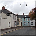 Two pairs of shoes dangle high above Wyeverne Road, Cardiff